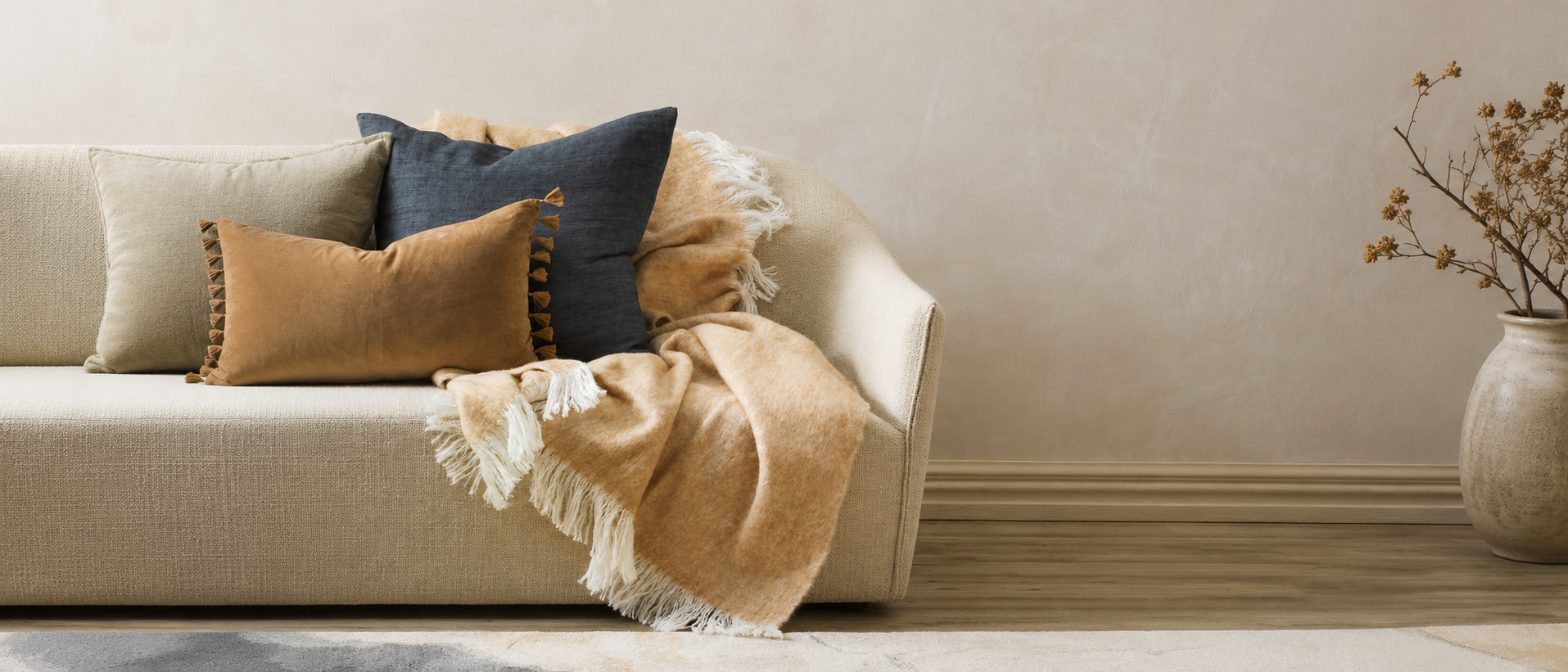 Textured cushions arranged in a relaxed interior
