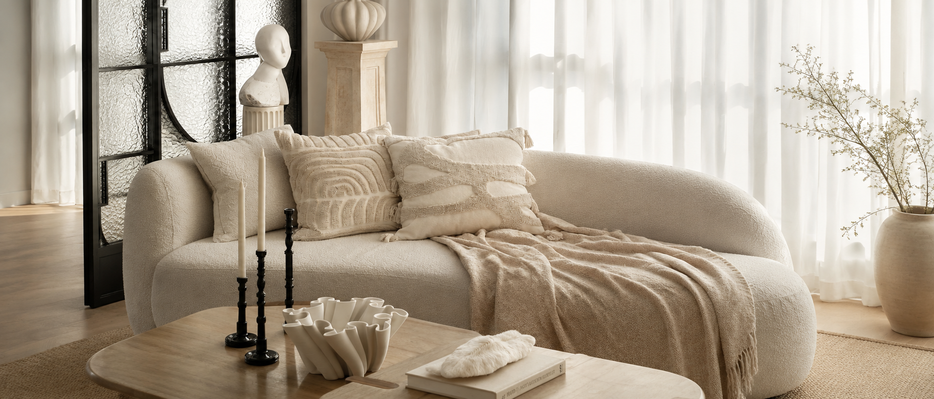 Soft cushions and throws styled in a calm living space